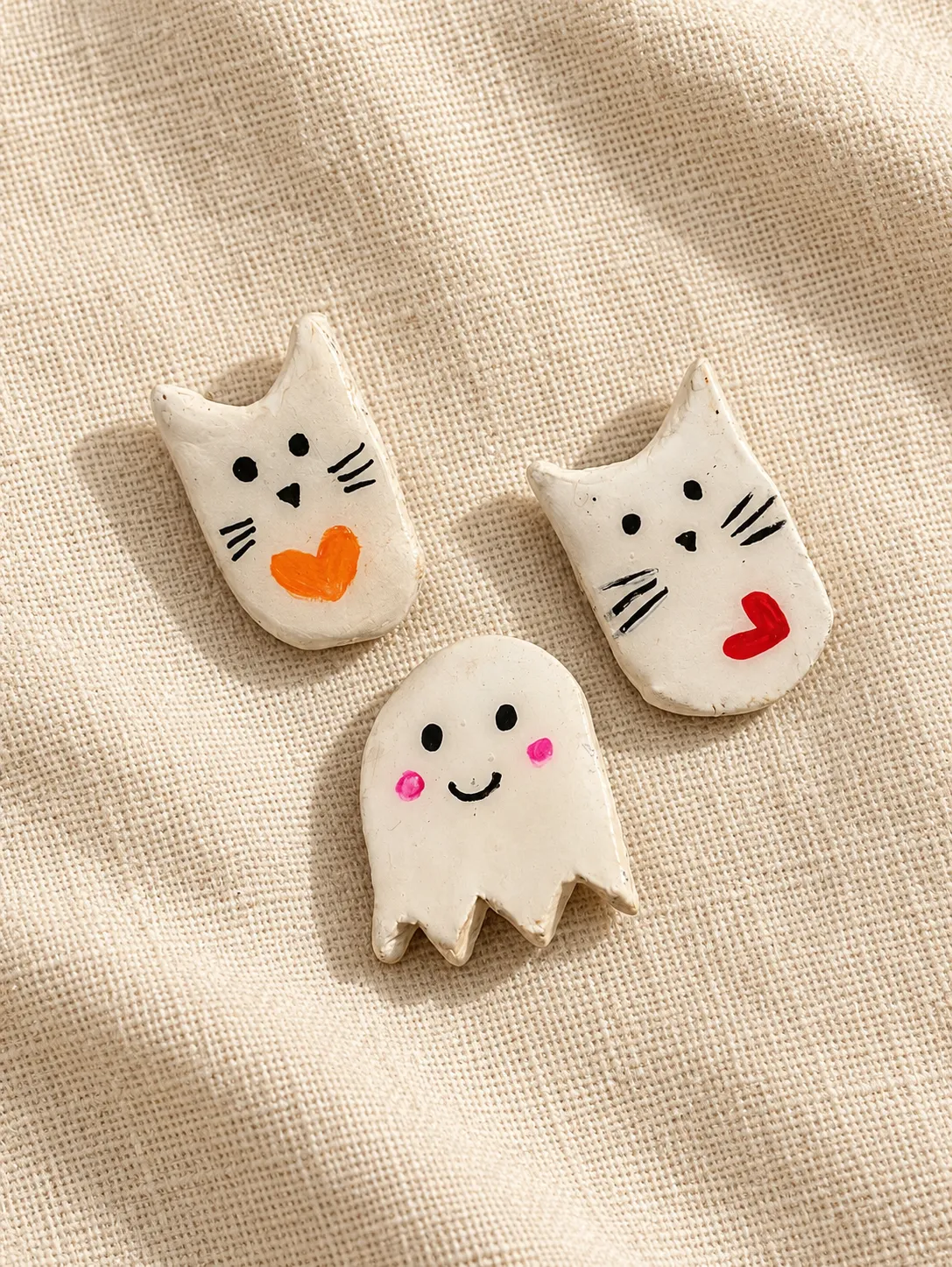 Hand-sculpted clay cat and ghost charms